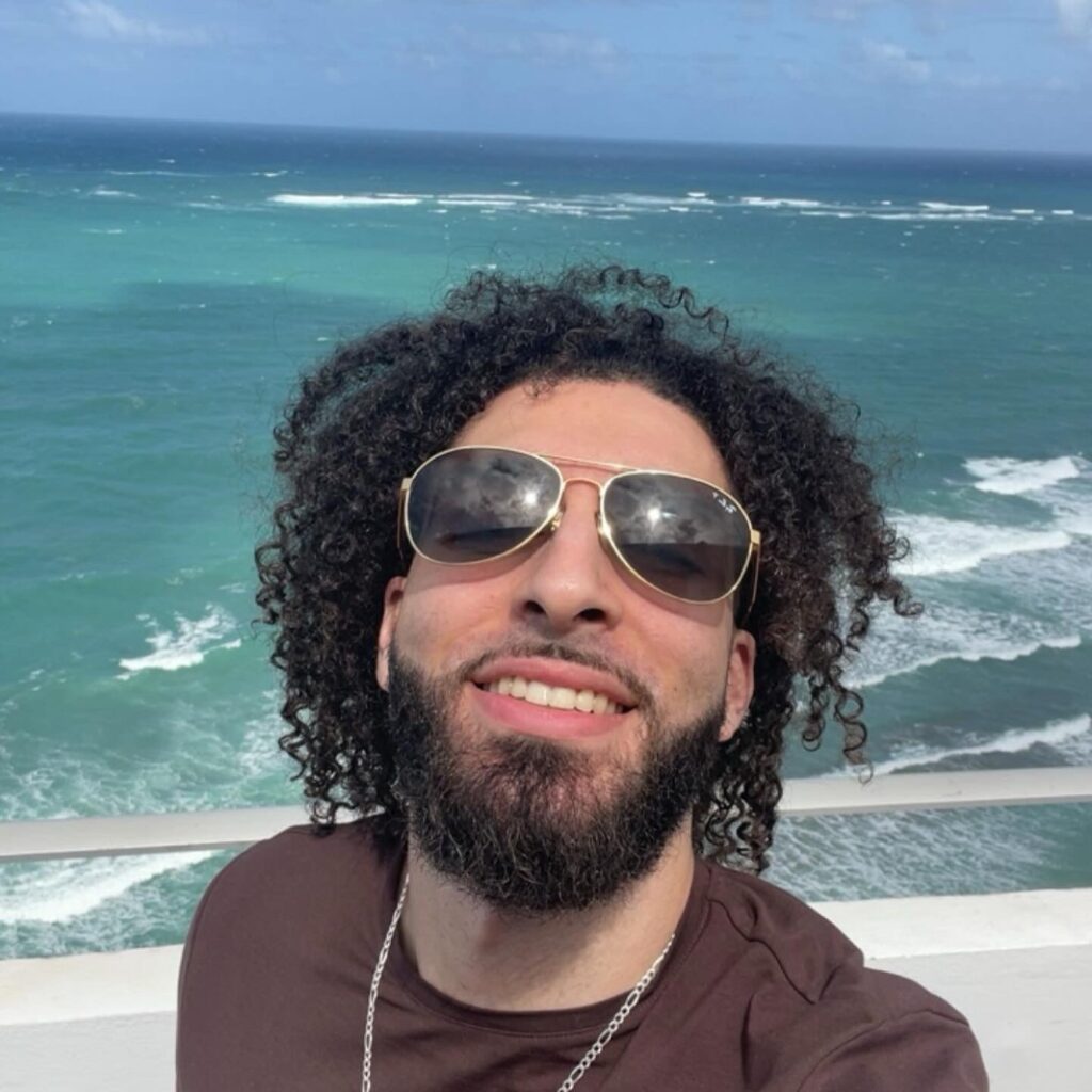 Man with long hair in a curly style