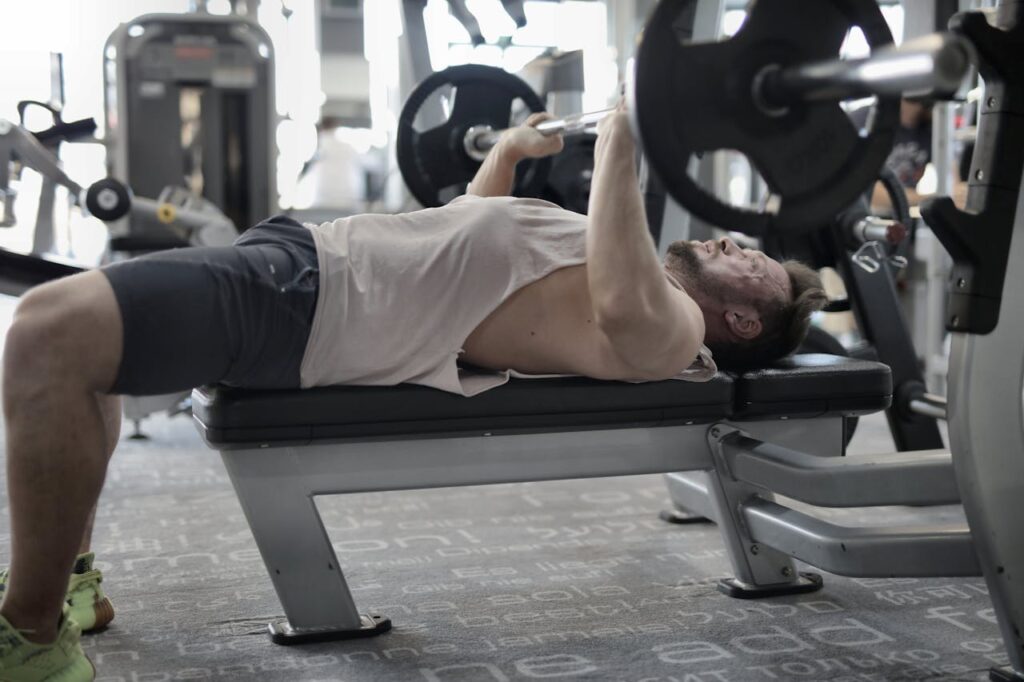 Man lifting weights to build muscle